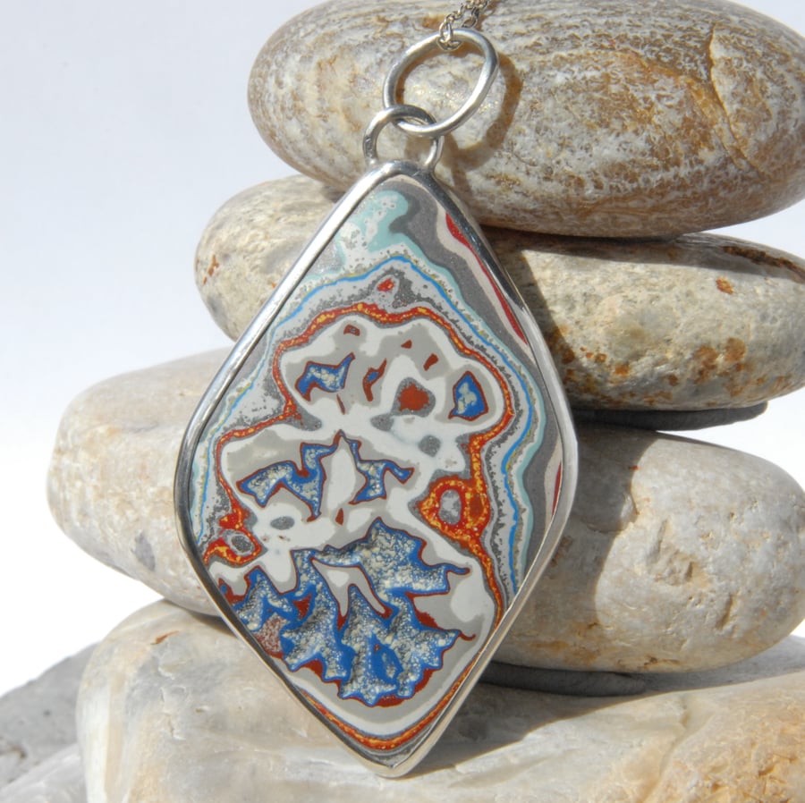 Sterling silver and fordite diamond shaped pendant
