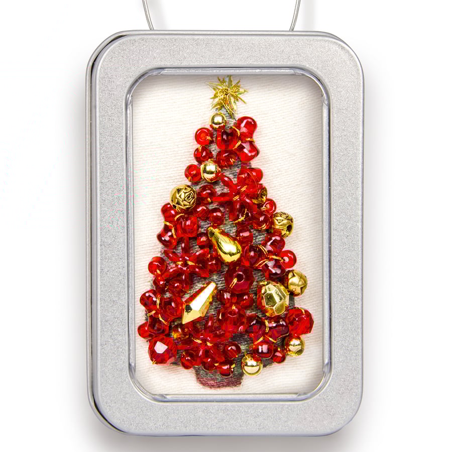 Christmas tree in a little tin, red and gold