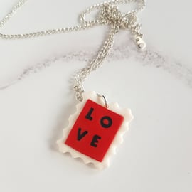 LOVE postage stamp necklace