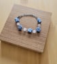 Handmade Blue Blossom Bracelet — Crochet Flower & Milky Quartz - Image 1