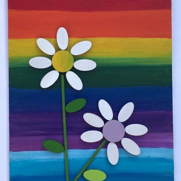White petal daisy picture on a rainbow background