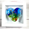 Fused glass cast heart in a box frame . 