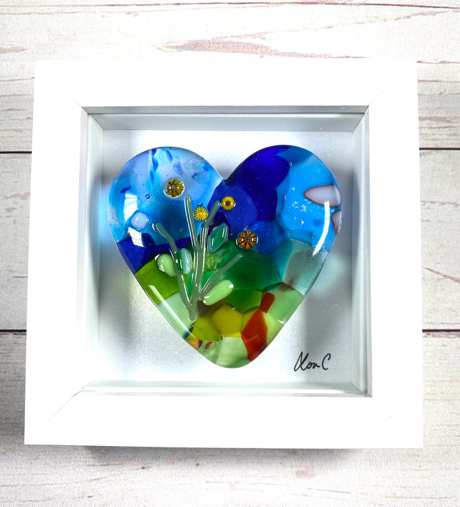 Fused glass cast heart in a box frame . 