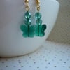 TEAL GREEN AND GOLD FACETED GLASS BUTTERFLY EARRINGS.