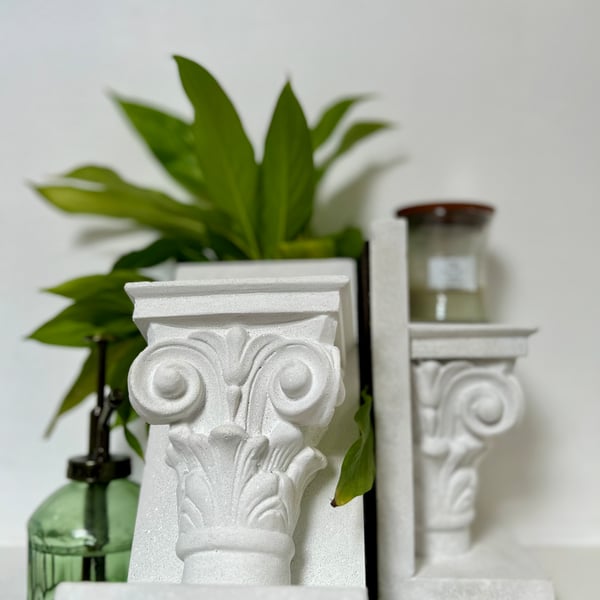 Decorative, architecturally influenced book-ends in white marble 