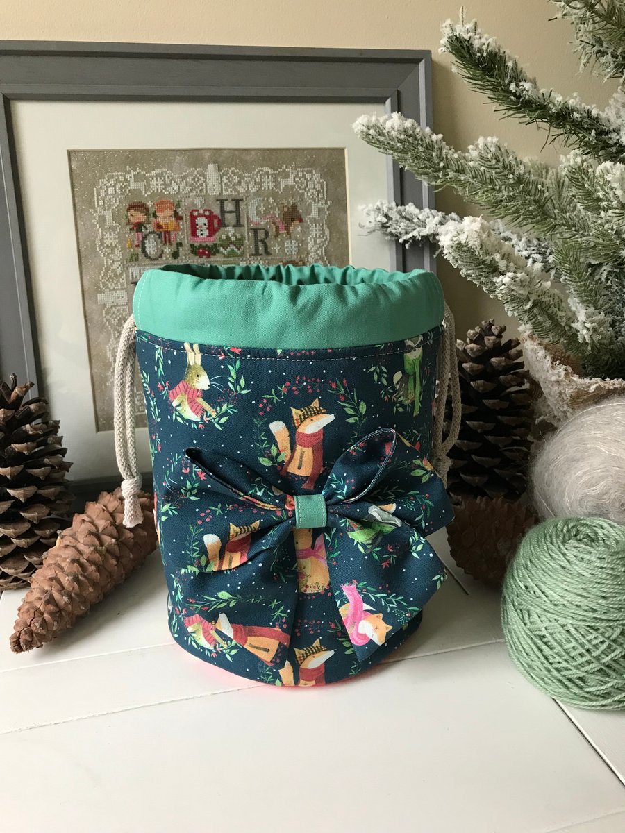 Cosy woodland animals round based bag with bow.