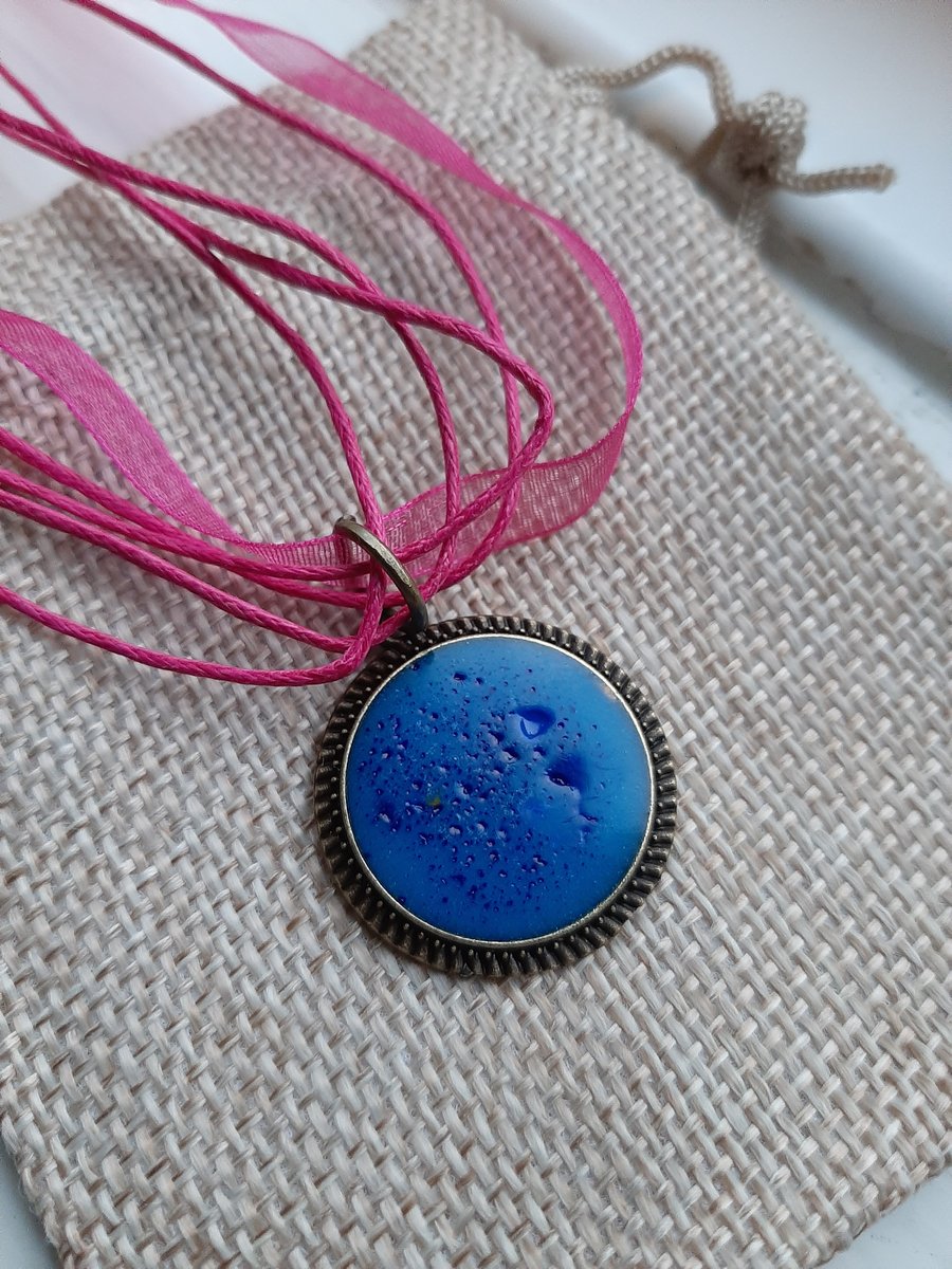 Unique Blue Circle crackled  resin pendent with a ribbon necklace