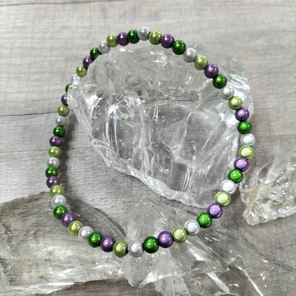 AL145C  Purple, greens and silver miracle bead elasticated anklet , 11.5"