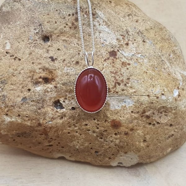 Small oval Red Carnelian pendant. 925 sterling silver. July birthstone necklace.