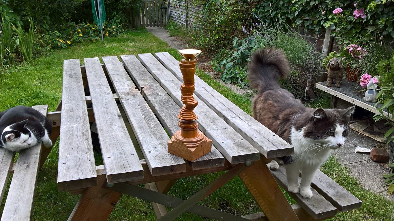 Spiral cherry candle  holderwith an Oak square base and a solid brass top