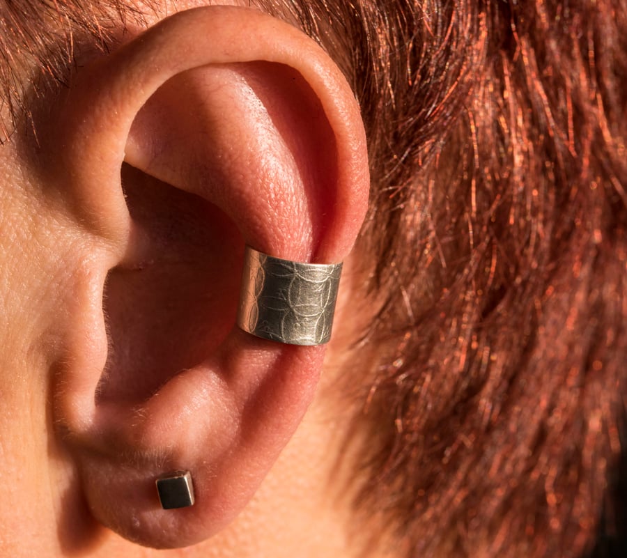 Chunky silver ear cuff with a leaf design. Satin finish.