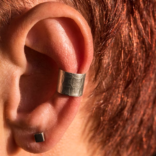 Chunky silver ear cuff with a leaf design. Satin finish.