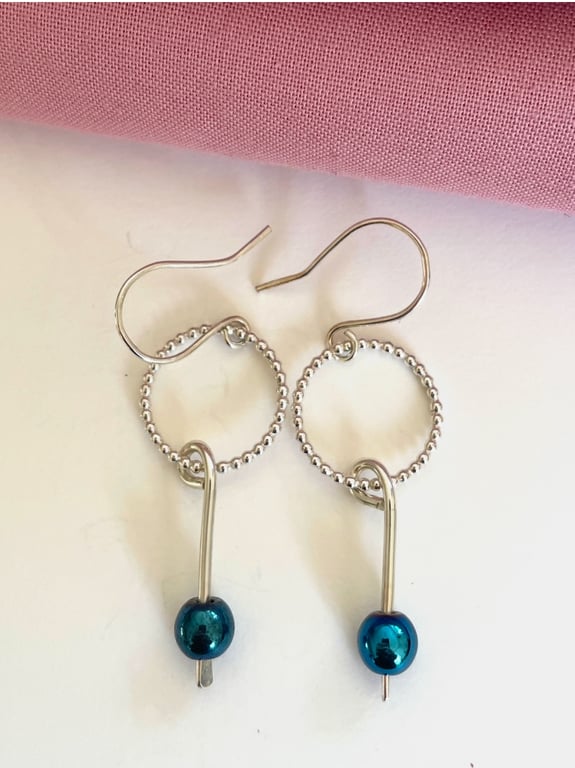 Hematite and silver drop earrings.