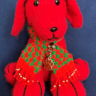 Red Dog wearing a knitted scarf