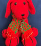 Red Dog wearing a knitted scarf
