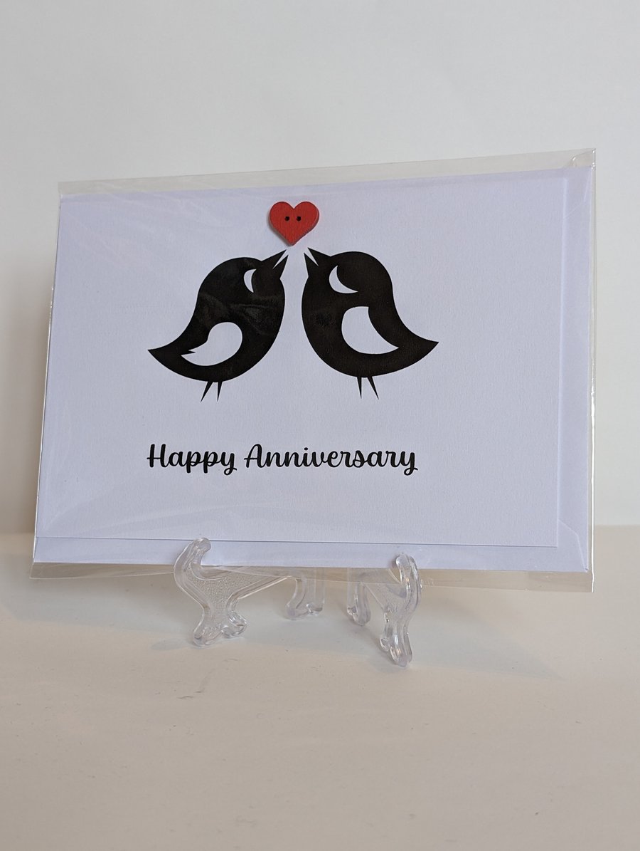 Happy Anniversary love birds with a red heart button greetings card 