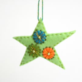 Christmas star hanging decoration with hand embroidered detail
