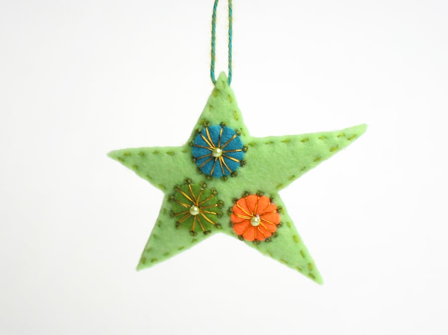 Christmas star hanging decoration with hand embroidered detail