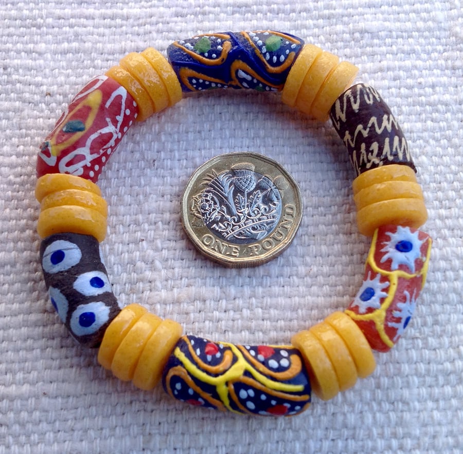6.5" African bead bracelet with golden yellow disks and multicolour beads
