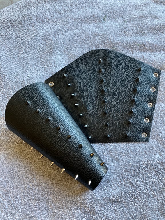 Large pair of black leather bracers with 3 rows of Chrome coloured spikes
