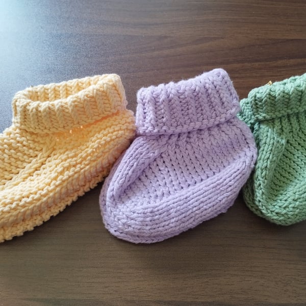 Handknitting babies booties, 100% cotton.