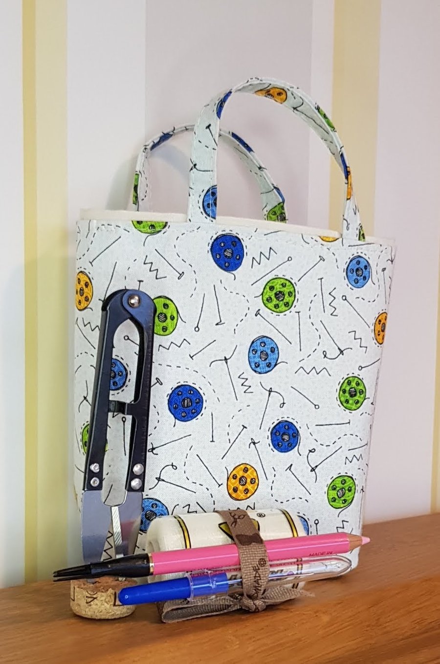 Sewing gift bag; bobbins and pins 