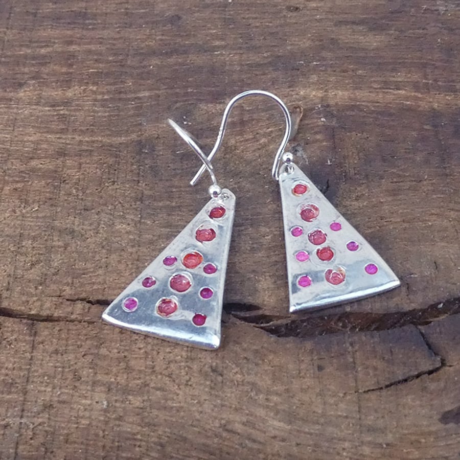 Silver spotty earrings, pink and orange.