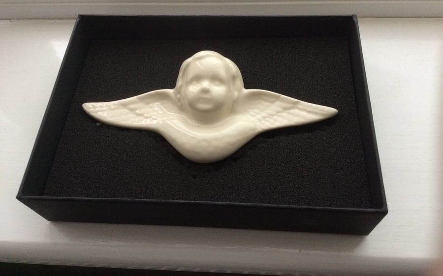 Wall-mounted angel plaques