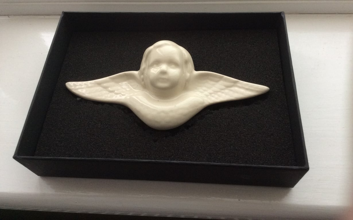 Wall-mounted angel plaques
