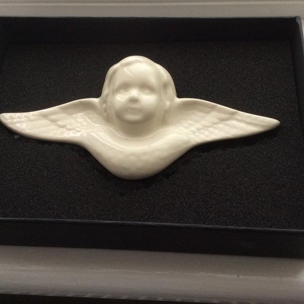 Wall-mounted angel plaques
