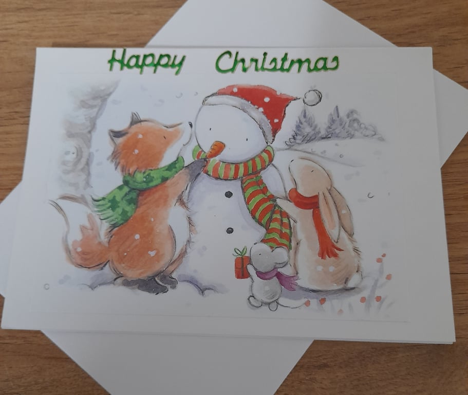 CUTE CHRISTMAS CARD WITH FOX, RABBIT AND MOUSE MAKING A SNOW MAN.