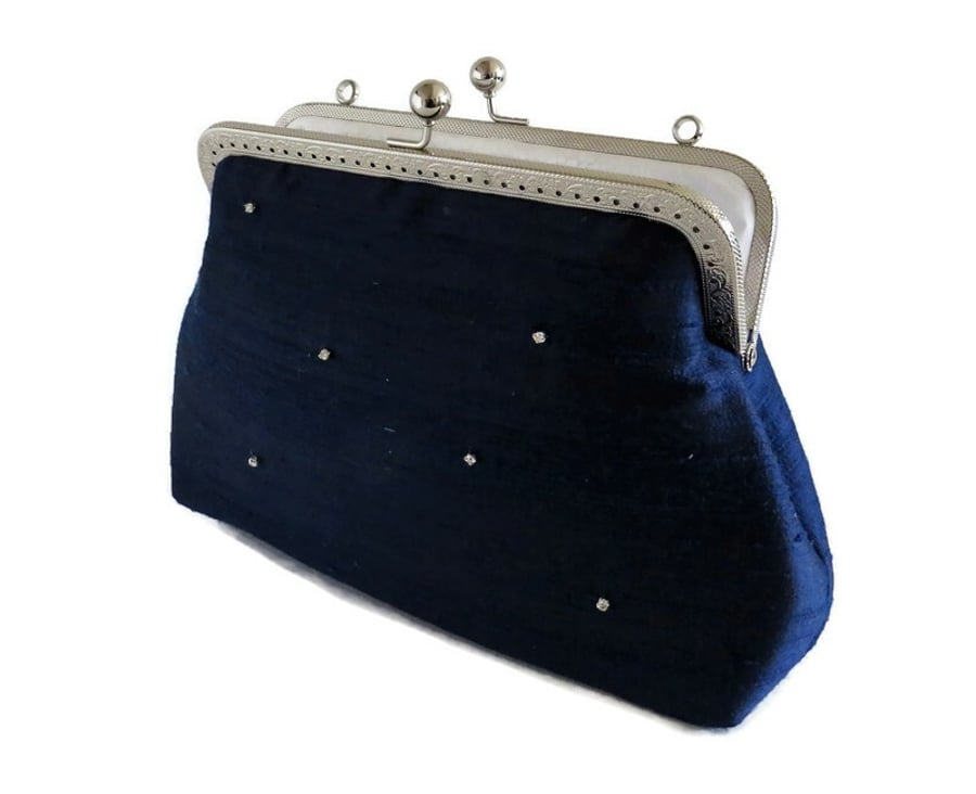 Silk dupion navy clutch bag fully lined in cotton with kiss lock frame and strap