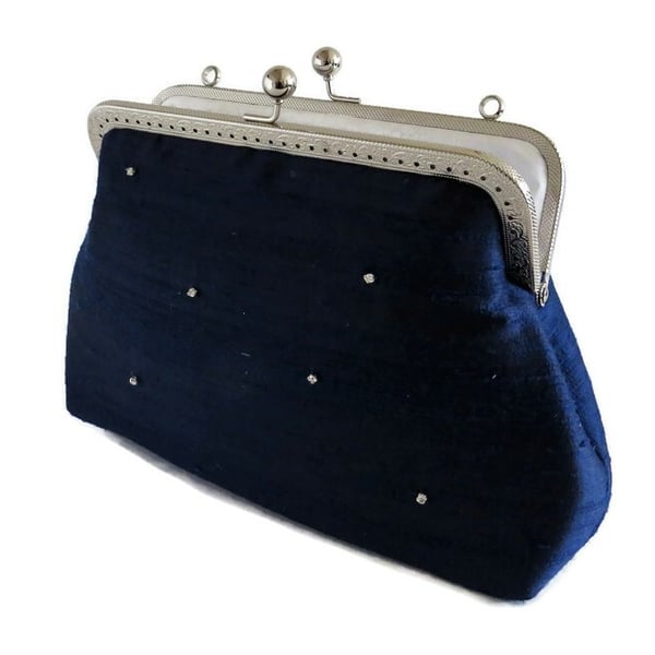 Silk dupion navy clutch bag fully lined in cotton with kiss lock frame and strap