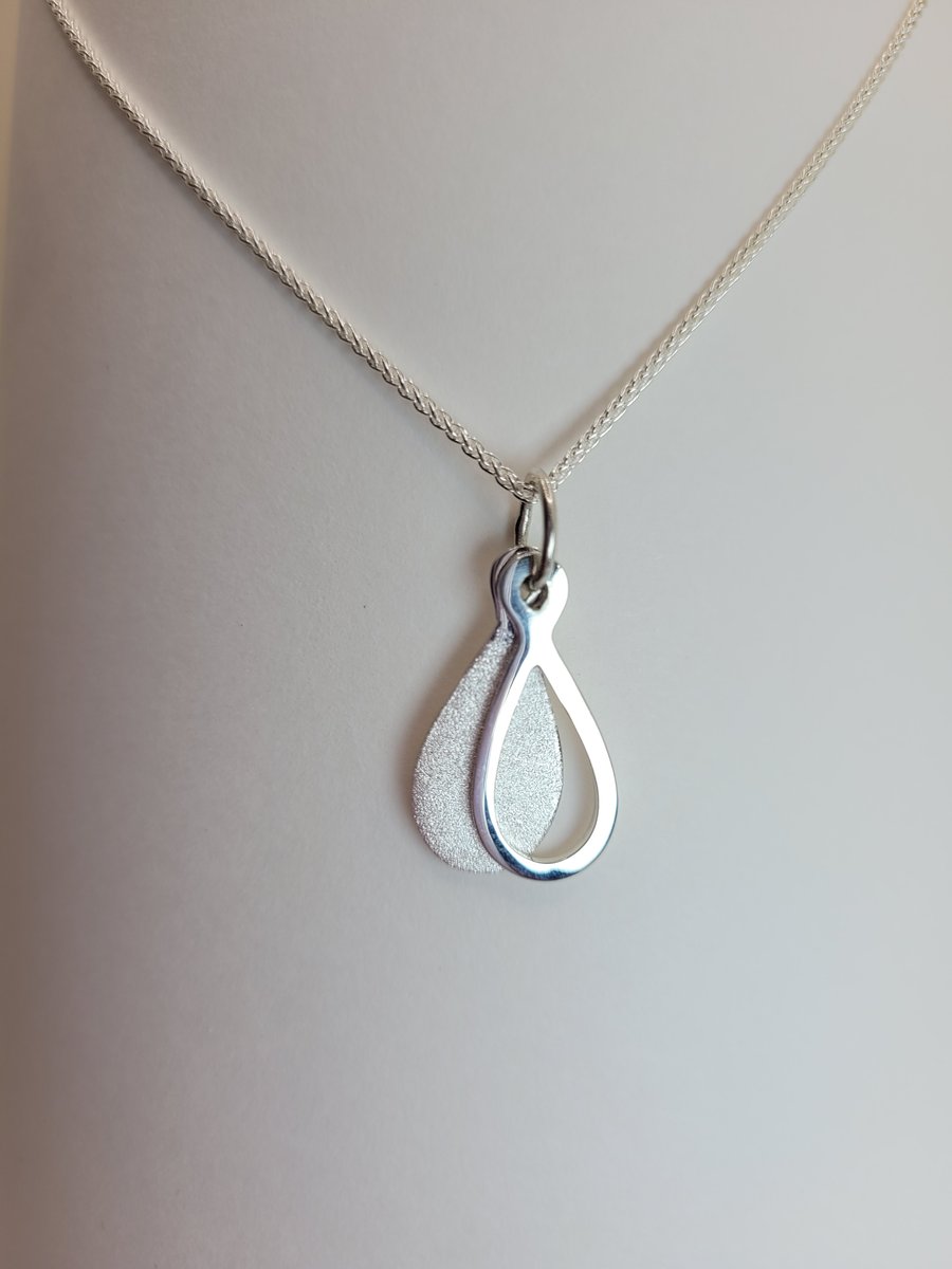 Silver teardrop shaped pendant
