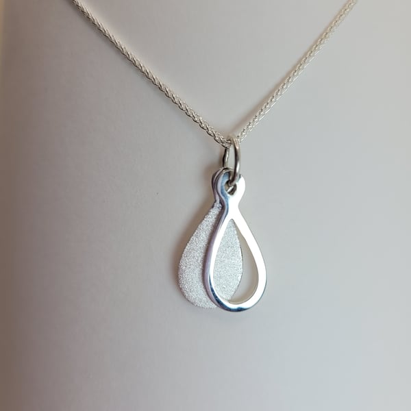 Silver teardrop shaped pendant