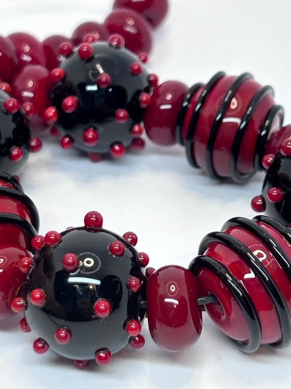 Handmade red and black lamp work glass beads