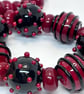 Handmade red and black lamp work glass beads