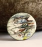 medium round brooch - scrolled red, yellow, black, blue on white - Image 2