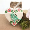 Small Ceramic bird in a heart decoration