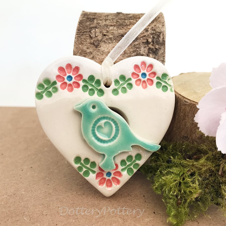 Small Ceramic bird in a heart decoration