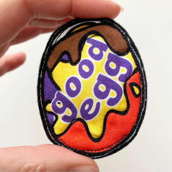 Up-cycled chocolate egg brooch pin or badge. 