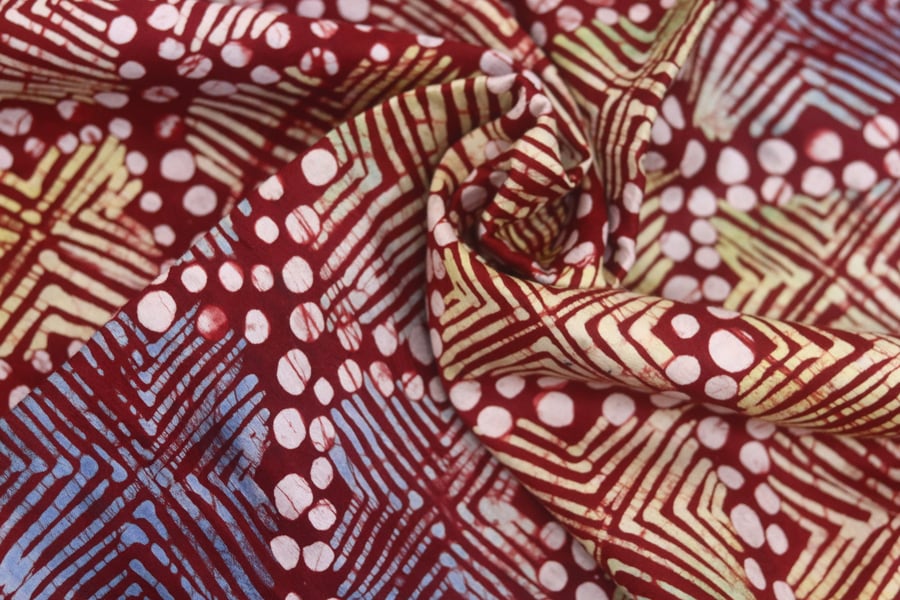 multicoloured crossed dots inspired hand printed African adire batik fabric sold