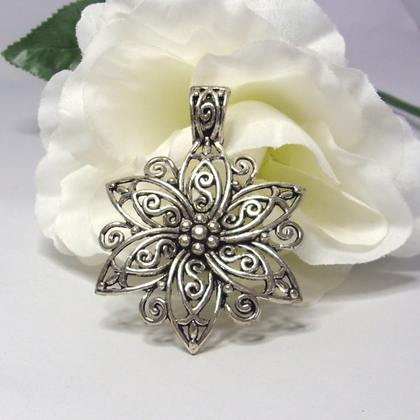 Large silver tone flower pendant