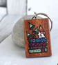 Books and fungi by candlelight. Pyrography key ring. - Image 1