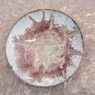 white dish scrolled dark pink and beige