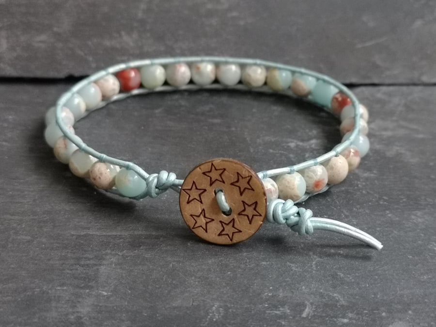 Light blue leather and sea sediment jasper bracelet with wooden button fastener 