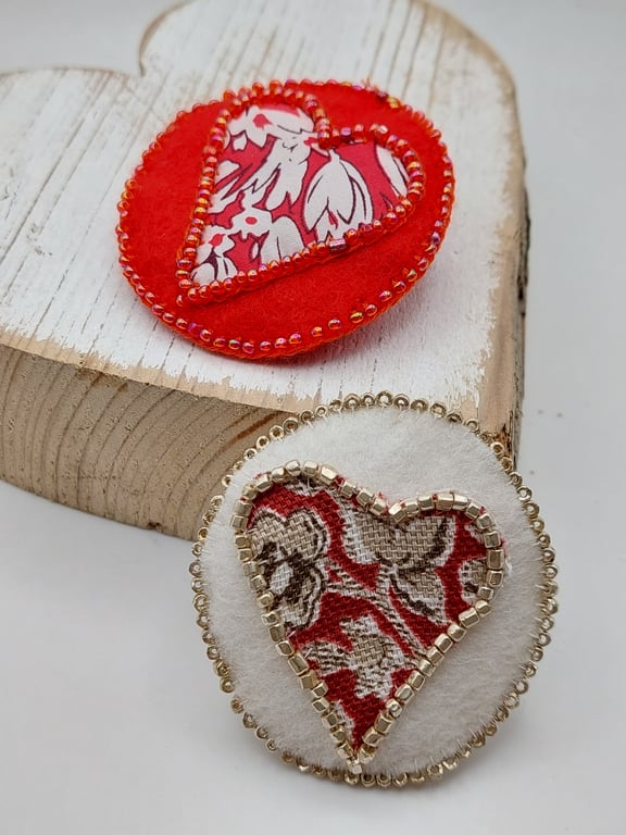 Red and white heart brooches 