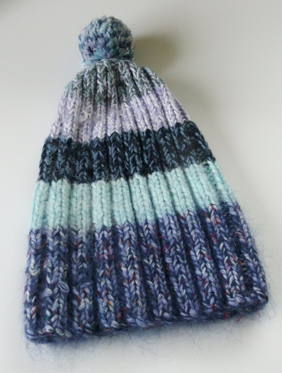Shades of blue knitted bobble hat hand made from warm soft chunky wool.