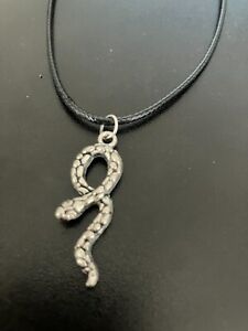 snake charm pendant on a 18" leather cord necklace
