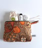 Make up or toiletries bag in a vintage Morris and Co autumnal Golden Lily print.